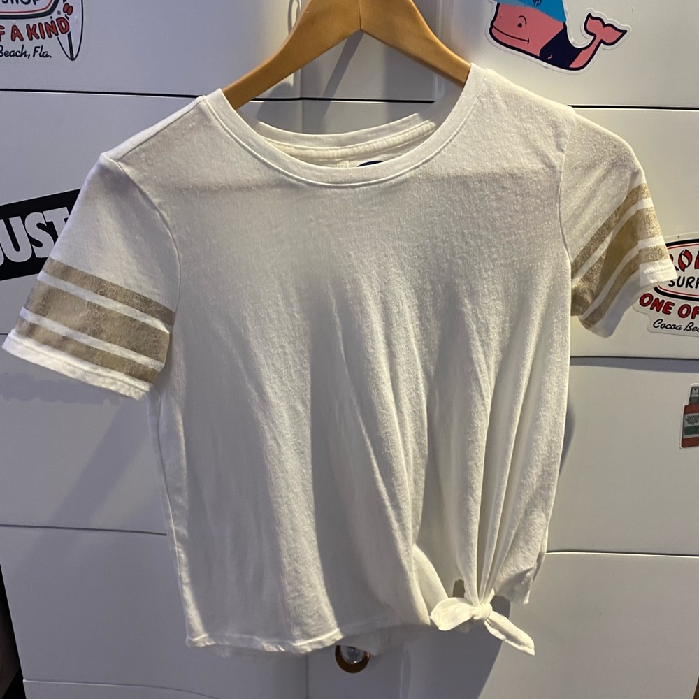 white top with gold stripes